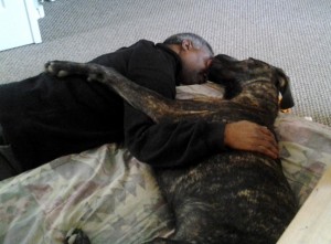 Man and Great Dane hugging